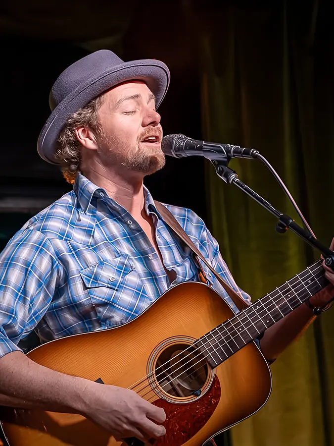 Travis Book Playing the Acoustic Guitar